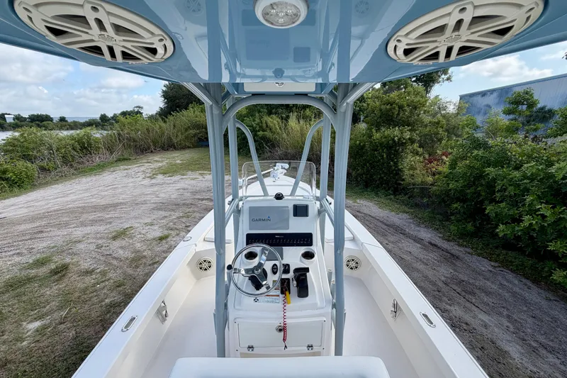 Slide: The Image of 2020 Pathfinder 2300 HPS boat interior with steering console and Garmin navigation system. - 14