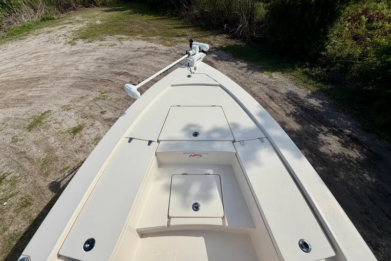 Slide: The Image of 2020 Pathfinder 2300 HPS boat on a grassy path, featuring a sleek deck design. - 17