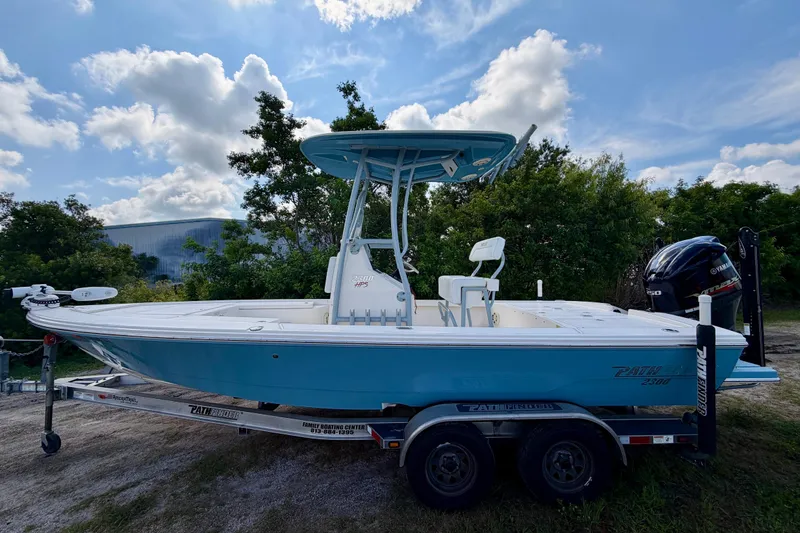 Slide: The Image of 2020 Pathfinder 2300 HPS boat on trailer, blue hull, Yamaha engine, outdoor setting. - 3