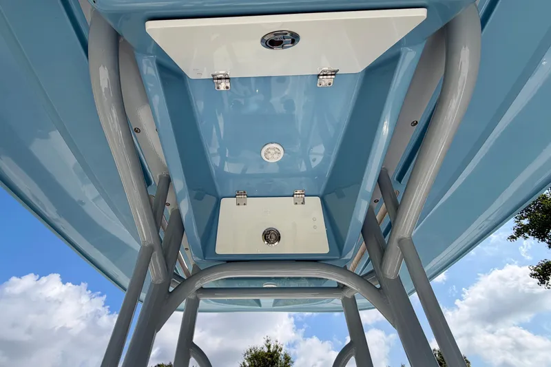 Slide: The Image of Underneath view of a 2020 Pathfinder 2300 HPS boat's T-top against a blue sky. - 9