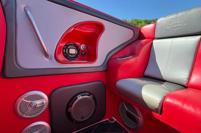 Slide: The Image of Interior of 2004 Outerlimits 42 Legacy boat with red and gray seating, audio system. - 13