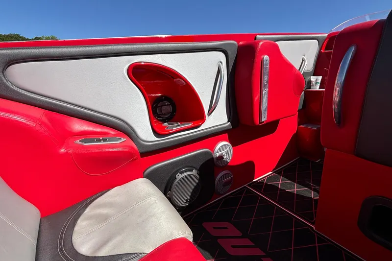 Slide: The Image of Interior of a 2004 Outerlimits 42 Legacy boat with red and gray seating. - 14