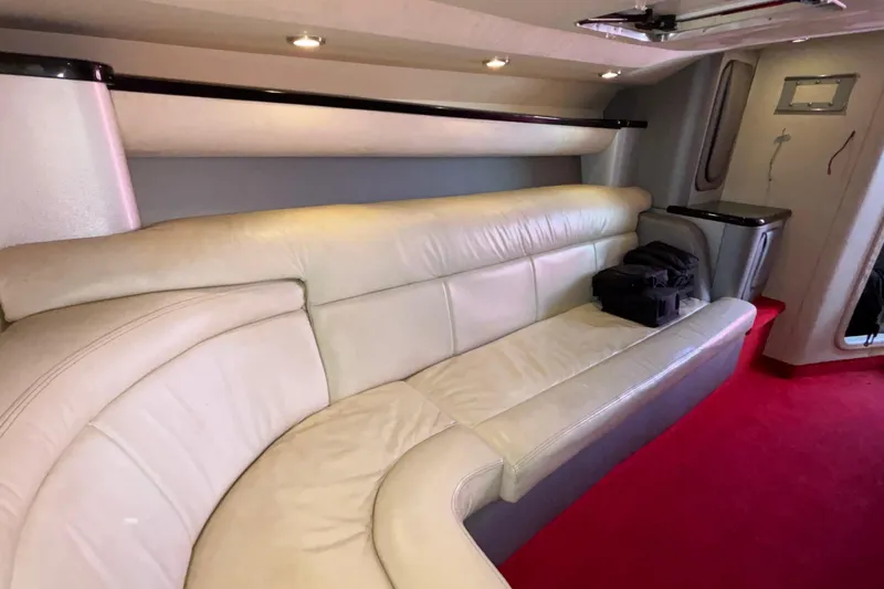 Slide: The Image of Luxurious interior of a 2004 Outerlimits 42 Legacy boat with cream leather seating. - 26
