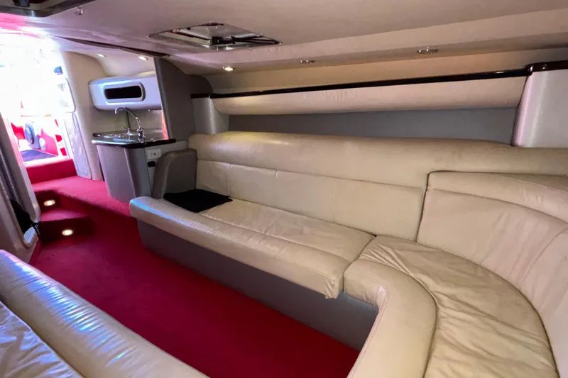 Slide: The Image of Luxurious interior of a 2004 Outerlimits 42 Legacy boat with plush seating and kitchenette. - 27