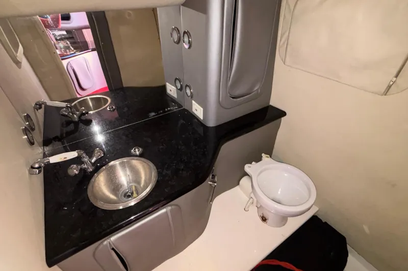 Slide: The Image of 2004 Outerlimits 42 Legacy boat interior with sink and compact toilet. - 29