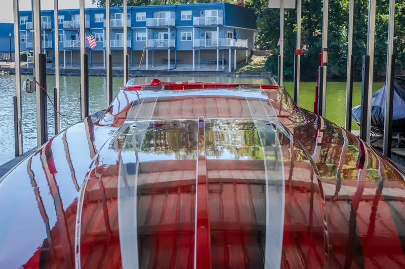 Slide: The Image of 2004 Outerlimits 42 Legacy boat docked, reflecting water and nearby buildings. - 36