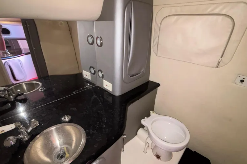 Slide: The Image of 2004 Outerlimits 42 Legacy boat bathroom with sink and toilet. - 30