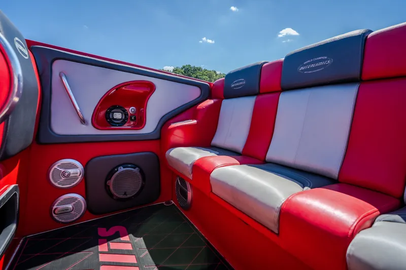 Slide: The Image of Luxurious red and gray interior of 2004 Outerlimits 42 Legacy boat with premium audio system. - 17