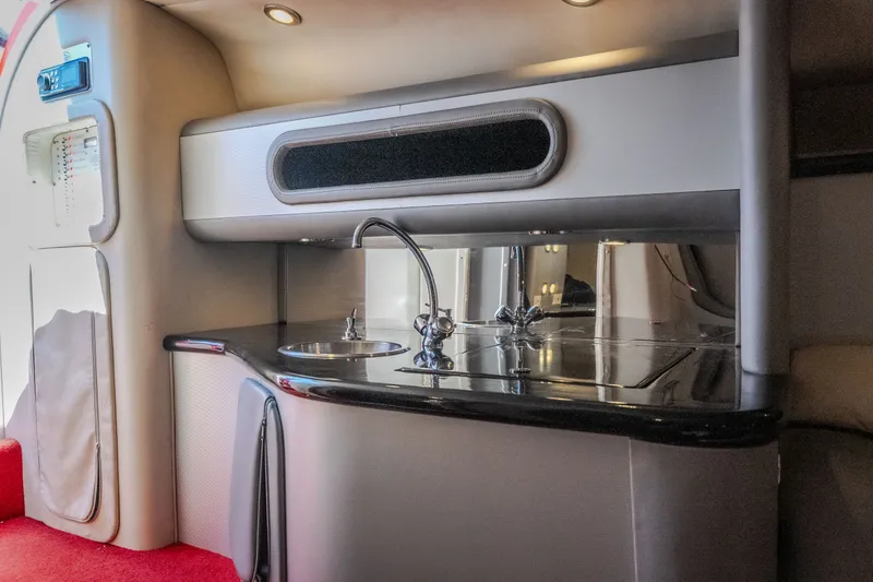 Slide: The Image of 2004 Outerlimits 42 Legacy yacht interior with sleek kitchenette and modern fixtures. - 41