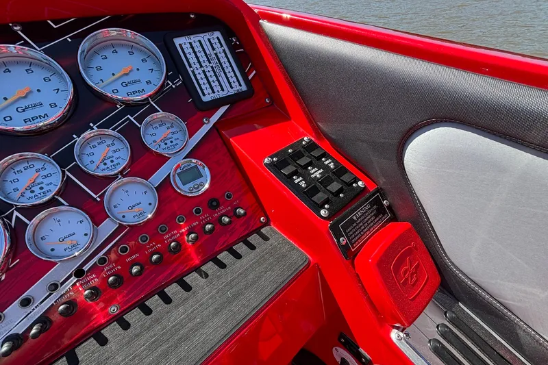 Slide: The Image of Dashboard of 2004 Outerlimits 42 Legacy boat with gauges and controls. - 40