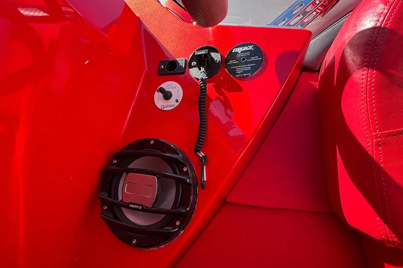 Slide: The Image of Red interior of 2004 Outerlimits 42 Legacy boat with speaker and control panel. - 41