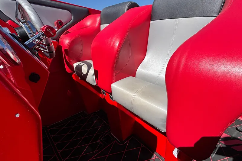 Slide: The Image of Red and gray interior of 2004 Outerlimits 42 Legacy boat cockpit. - 44