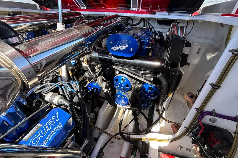 Slide: The Image of Engine compartment of a 2004 Outerlimits 42 Legacy boat with Mercury Racing components. - 51