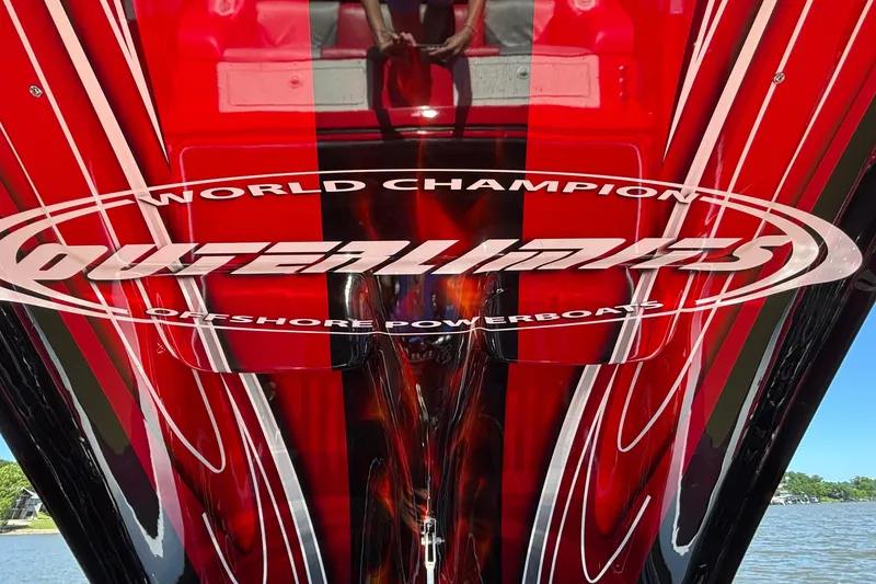 Slide: The Image of Red and black 2004 Outerlimits 42 Legacy powerboat with bold graphics and "World Champion" text. - 54