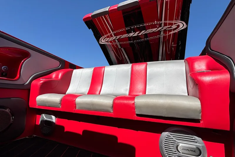 Slide: The Image of Red and gray interior of 2004 Outerlimits 42 Legacy boat with Alpine speakers. - 63