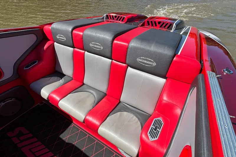 Slide: The Image of Red and gray seating on a 2004 Outerlimits 42 Legacy boat, with stylish design. - 7