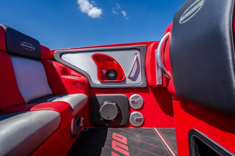 Slide: The Image of Interior of 2004 Outerlimits 42 Legacy boat with red and gray seating. - 19