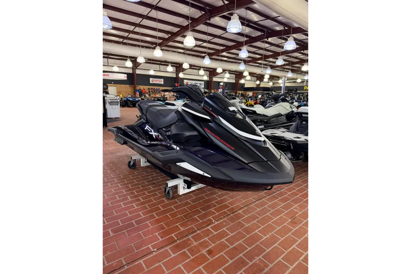 The Image of 2026 Yamaha WaveRunner FX SVHO in showroom, sleek black design, displayed on brick floor. - 0