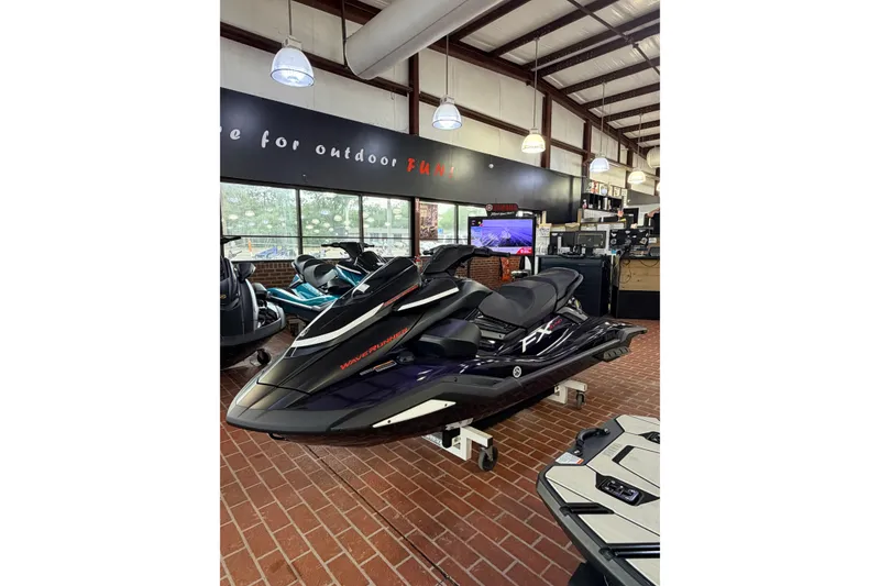 Slide: The Image of 2026 Yamaha WaveRunner FX SVHO displayed in a showroom with brick flooring. - 2