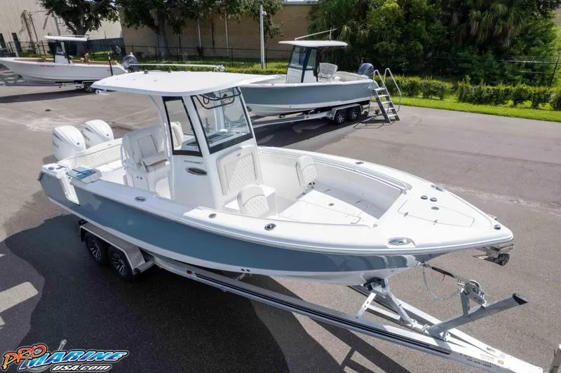 Slide: The Image of 2026 Sea Hunt Ultra 265 SE boat on trailer, parked outdoors. - 1