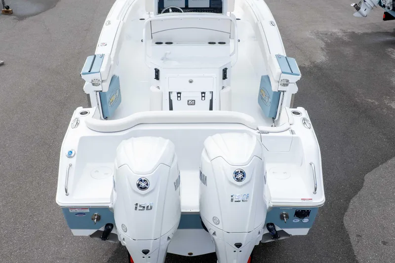 Slide: The Image of 2026 Sea Hunt Ultra 265 SE boat with dual Yamaha 150 engines, viewed from above. - 21