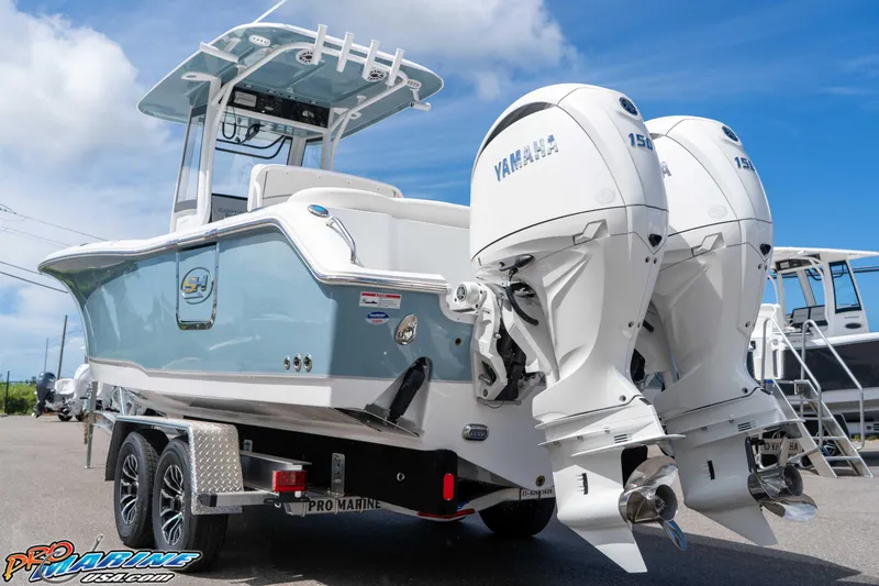 Slide: The Image of 2026 Sea Hunt Ultra 265 SE boat with dual Yamaha engines on a trailer. - 41
