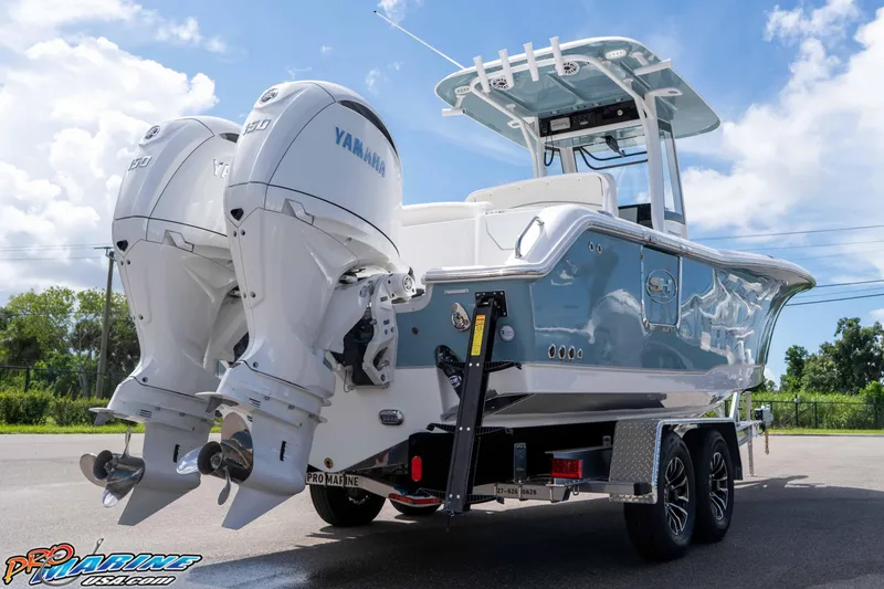 Slide: The Image of 2026 Sea Hunt Ultra 265 SE boat with dual Yamaha engines on a trailer. - 45