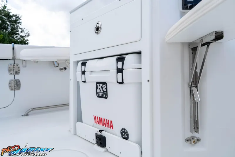 Slide: The Image of 2026 Sea Hunt Ultra 265 SE boat interior with K2 cooler and Yamaha branding. - 8