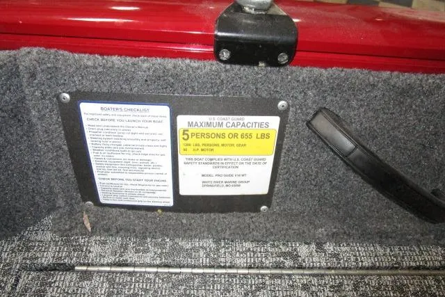 Slide: The Image of 2024 Tracker Pro Guide V-16 WT boat capacity label, indicating a maximum of 5 persons or 655 lbs. - 10