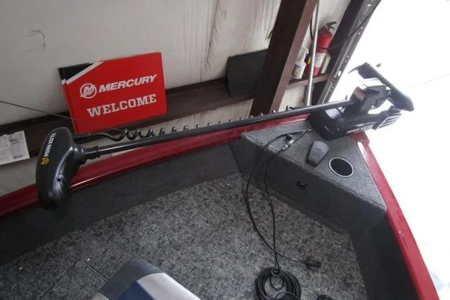 Slide: The Image of 2024 Tracker Pro Guide V-16 WT boat interior with trolling motor and Mercury signage. - 9