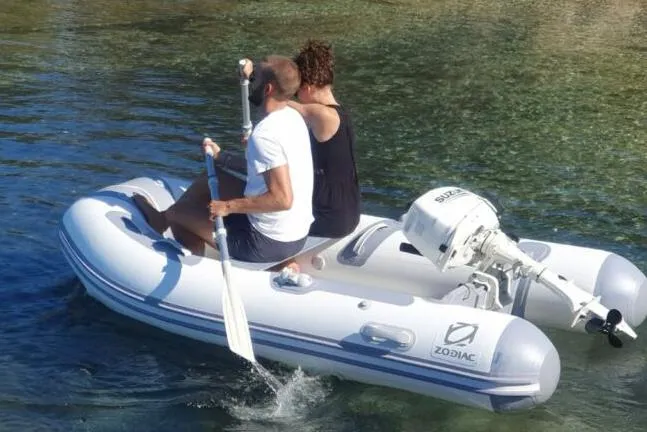 Slide: The Image of Manufacturer Provided Image: Zodiac Cadet 310 Aero 2026 with two people on calm water. - 3