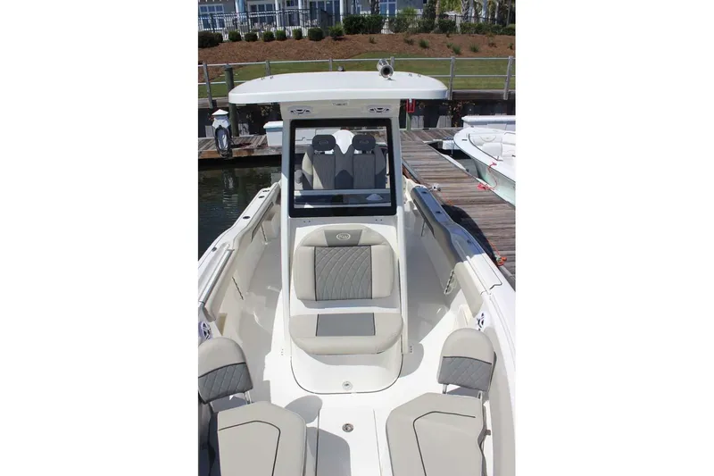 Slide: The Image of 2026 Key West 239 FS boat interior at dock, featuring sleek seating and modern design. - 14