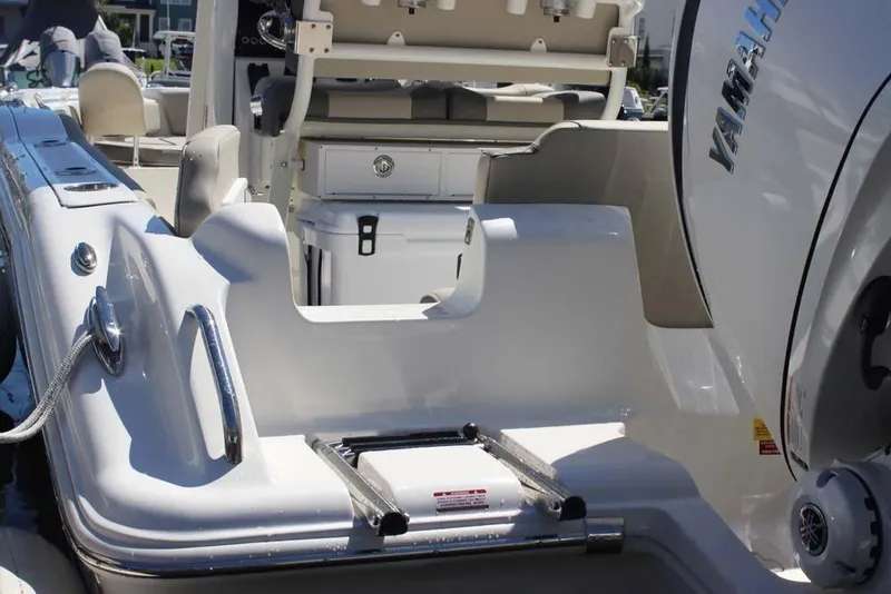 Slide: The Image of 2026 Key West 239 FS boat with Yamaha engine, featuring a sleek deck and seating area. - 24