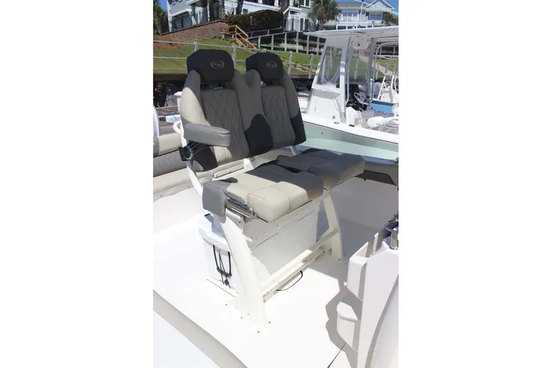 Slide: The Image of 2026 Key West 239 FS boat with dual cushioned seats and sleek design. - 21