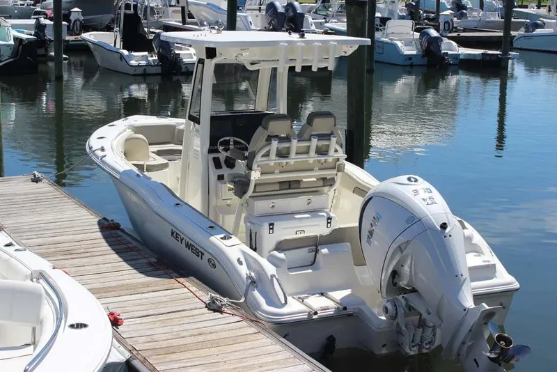 Slide: The Image of 2026 Key West 239 FS boat docked in a marina, featuring a sleek design and powerful engine. - 5