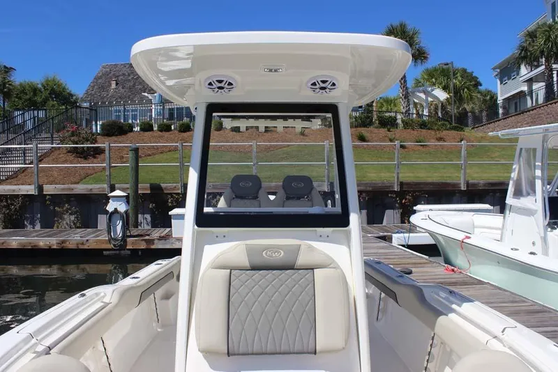 Slide: The Image of 2026 Key West 239 FS boat docked, featuring sleek design and comfortable seating. - 15