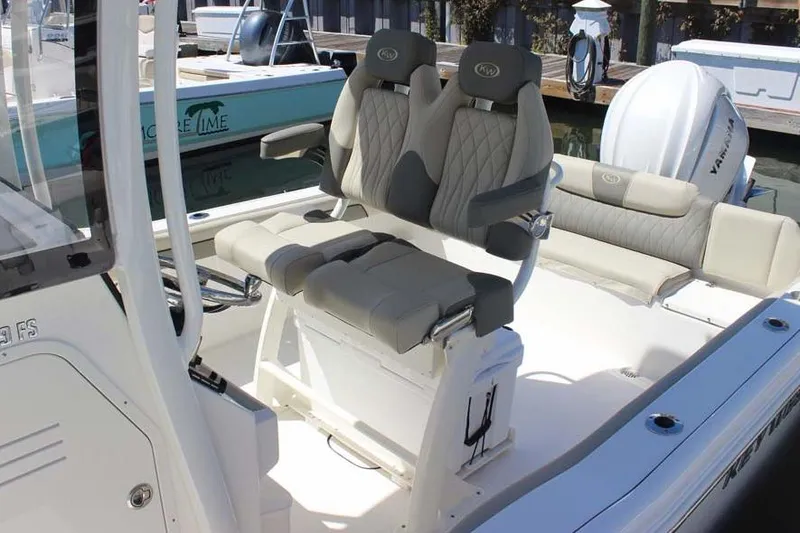 Slide: The Image of 2026 Key West 239 FS boat interior with cushioned seating and modern design. - 20
