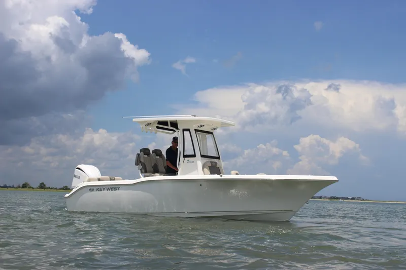 Slide: The Image of 2026 Key West 239 FS boat on water under cloudy sky. - 1