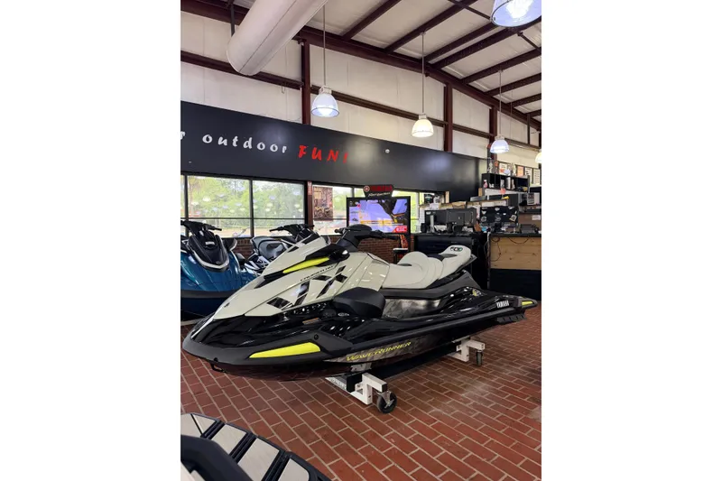 Slide: The Image of 2026 Yamaha WaveRunner VX Cruiser HO displayed in a showroom with brick flooring. - 3