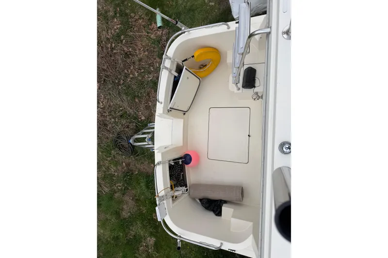 Slide: The Image of 2005 Camano Trawler cockpit with safety equipment and storage compartments. - 31