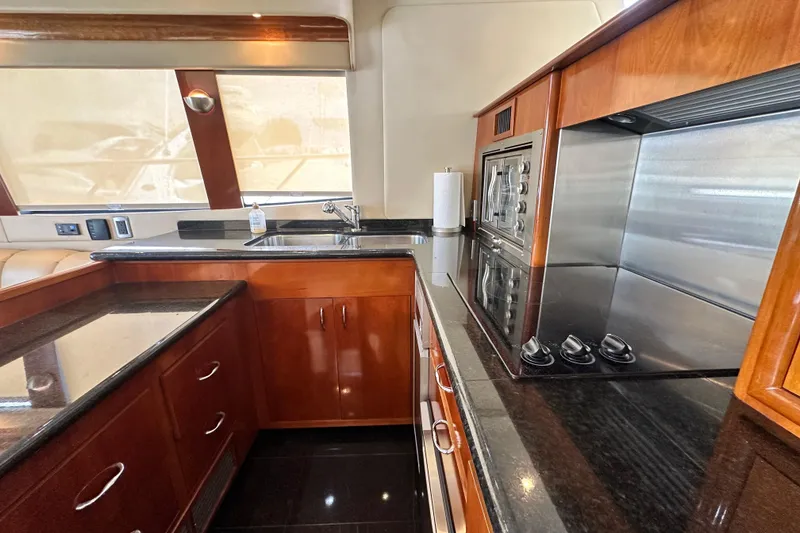 Slide: The Image of Luxurious kitchen interior of 2006 Carver 56 Voyager yacht with sleek countertops and modern appliances. - 10