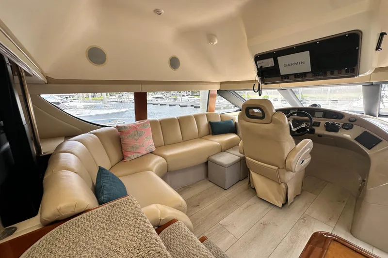 Slide: The Image of Luxurious interior of 2006 Carver 56 Voyager yacht with plush seating and navigation equipment. - 12