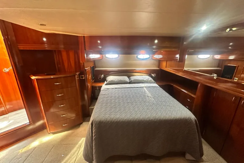 Slide: The Image of Luxurious cabin interior of 2006 Carver 56 Voyager yacht with elegant wood finish. - 18