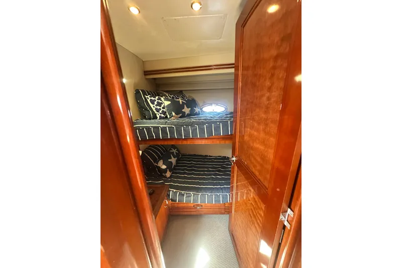 Slide: The Image of Bunk beds in 2006 Carver 56 Voyager yacht cabin with wooden interior. - 19