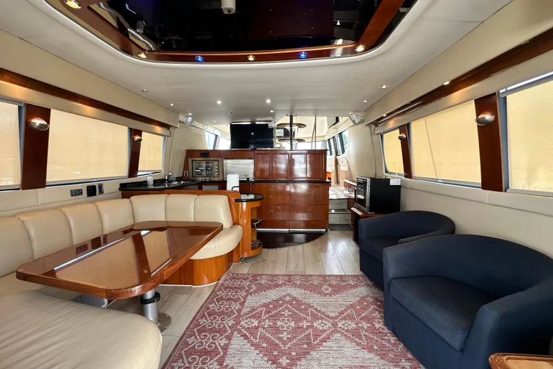 Slide: The Image of Luxurious interior of a 2006 Carver 56 Voyager yacht with elegant seating and wood finishes. - 4
