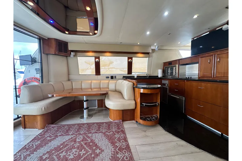 Slide: The Image of Luxurious interior of a 2006 Carver 56 Voyager yacht with elegant wood finishes. - 5