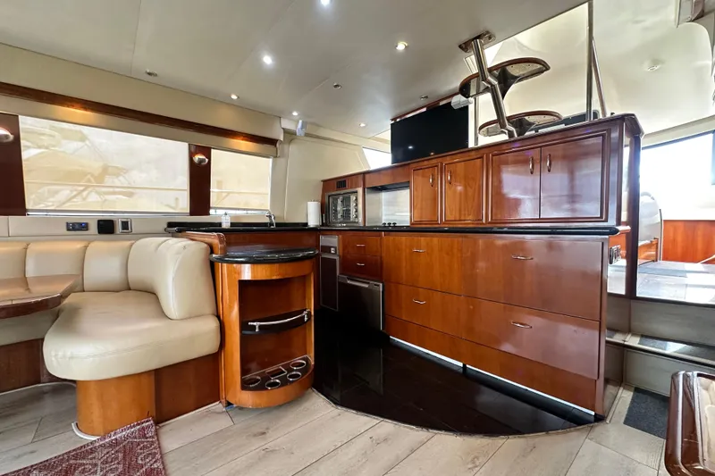 Slide: The Image of Luxurious interior of a 2006 Carver 56 Voyager yacht with elegant wood cabinetry and seating. - 7