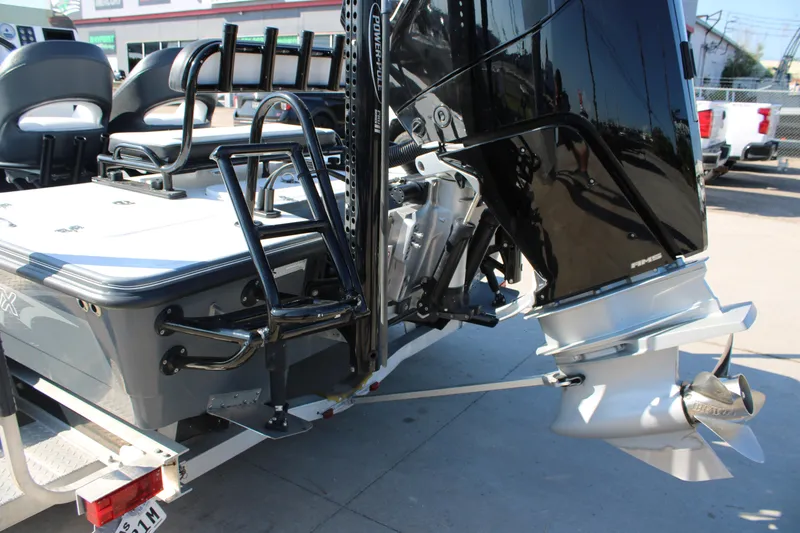 Slide: The Image of 2023 Mamba 24VX boat with powerful outboard motor and sleek design. - 12