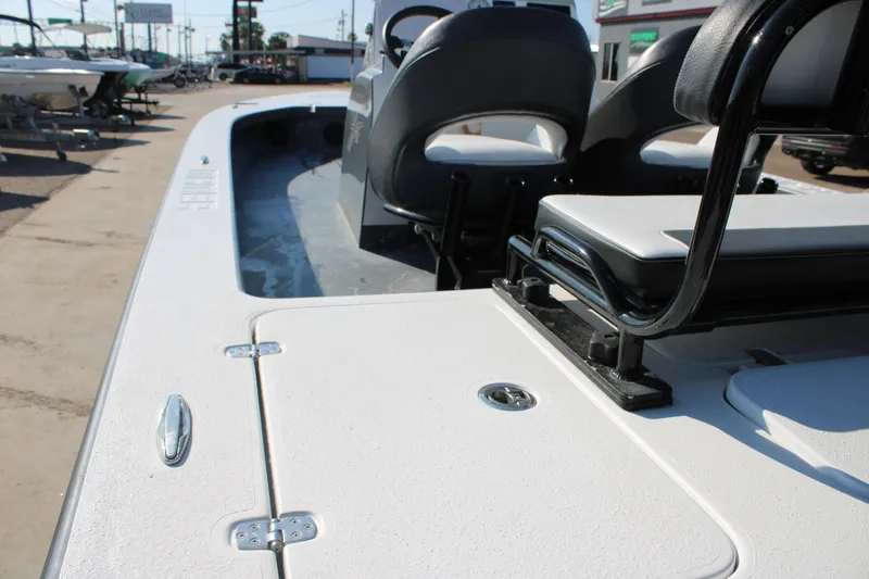 Slide: The Image of 2023 Mamba 24VX boat interior with seating and storage compartments. - 13