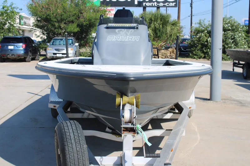 Slide: The Image of 2023 Mamba 24VX boat on trailer in outdoor setting. - 4